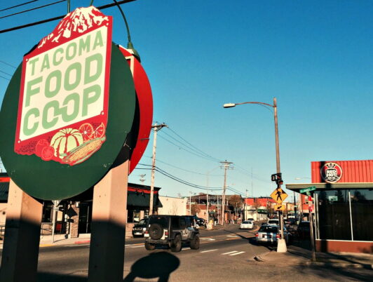 A sign says Tacoma Food Coop in Tacoma WA