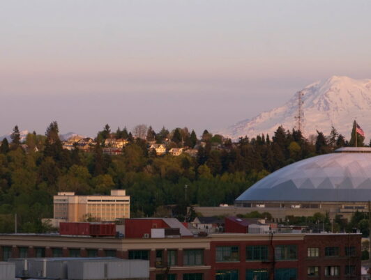 mt rainier over the tacoma dome under a full moon