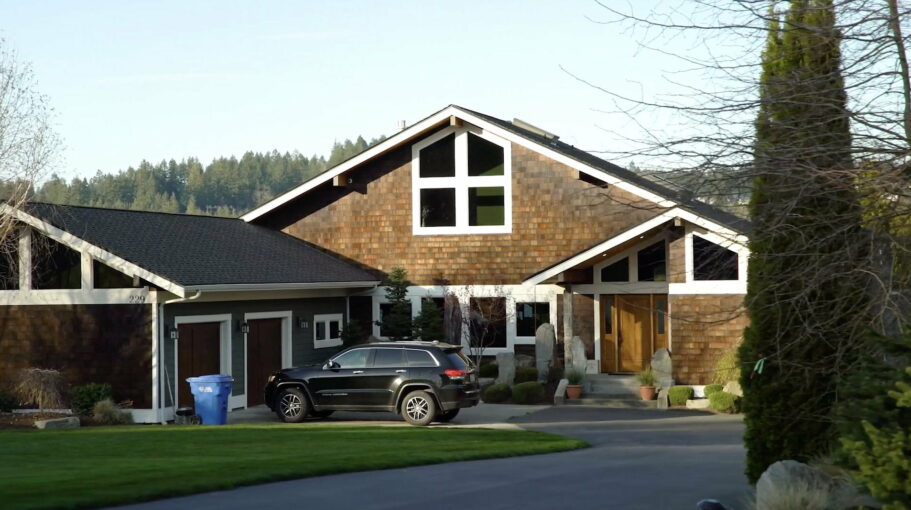 fox island home with wood siding