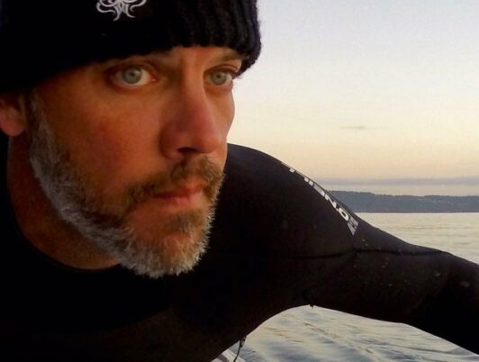 dean burke paddling on commencement bay