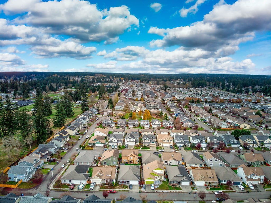 A housing development in Frederickson Washington photographed from above on a cloudy day. Frederickson is a neighborhood near JBLM and Tacoma, Washington.