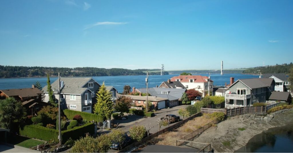 Day Island Neighborhood of Tacoma Washington photographed from above. The island is narrow, only a few homes wide.
