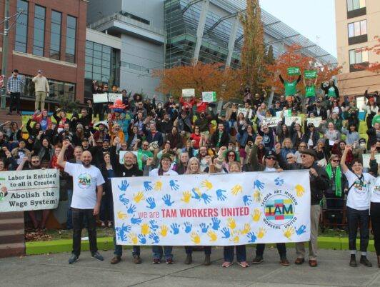 A hundred or so people from Tacoma Art Museum Workers United gather in Tolefson Plaza in Downtown Tacoma to celebrate forming their union.