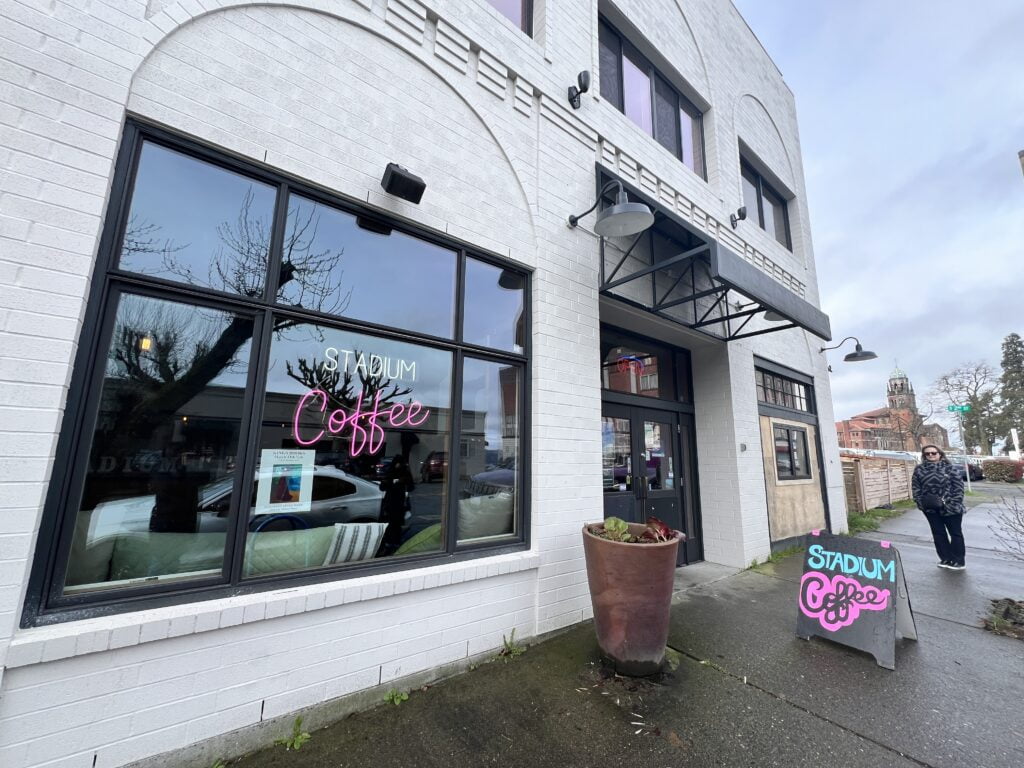 the exterior of local tacoma coffee shop Stadium Cafe in the Stadium District Neighborhood of Tacoma, Washington. The exteior is white brick