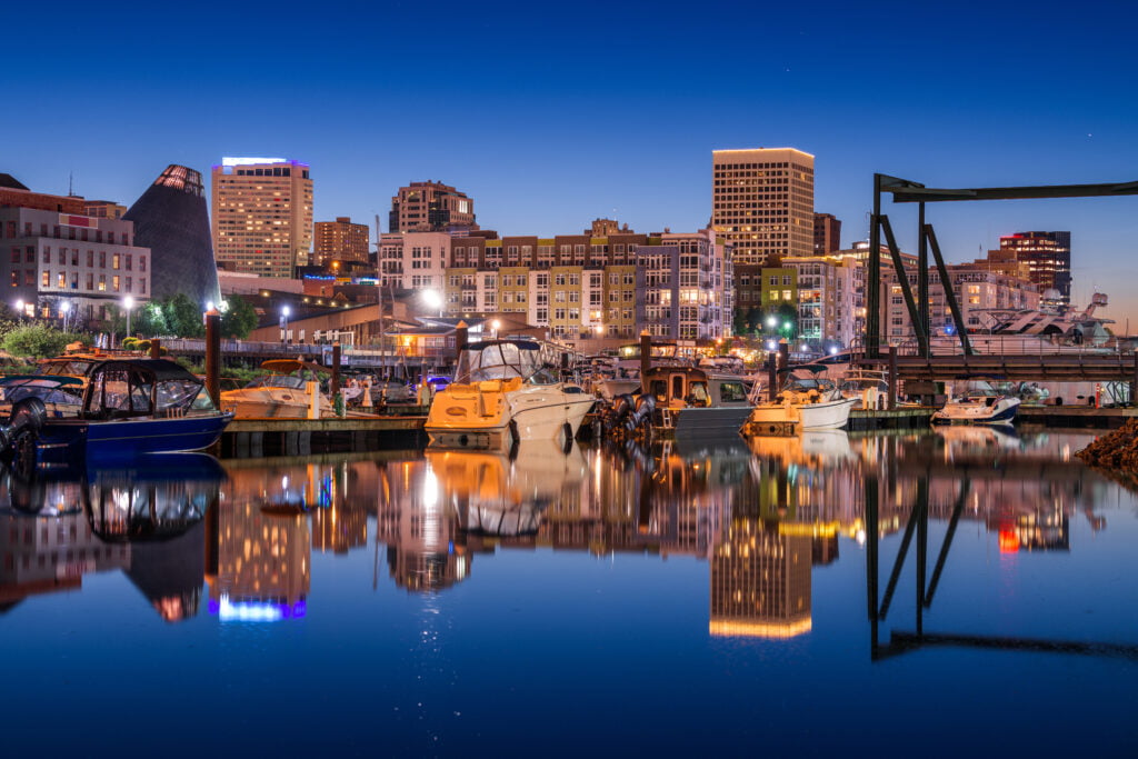 The thea foss waterway of tacoma washington with the tacoma skyline reflected in the waters of commencement bay